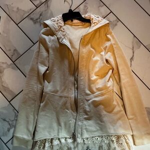 Cream zip up hoodie with lace.